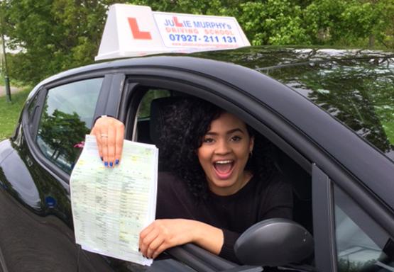 Driving school pupil after passing her test first time